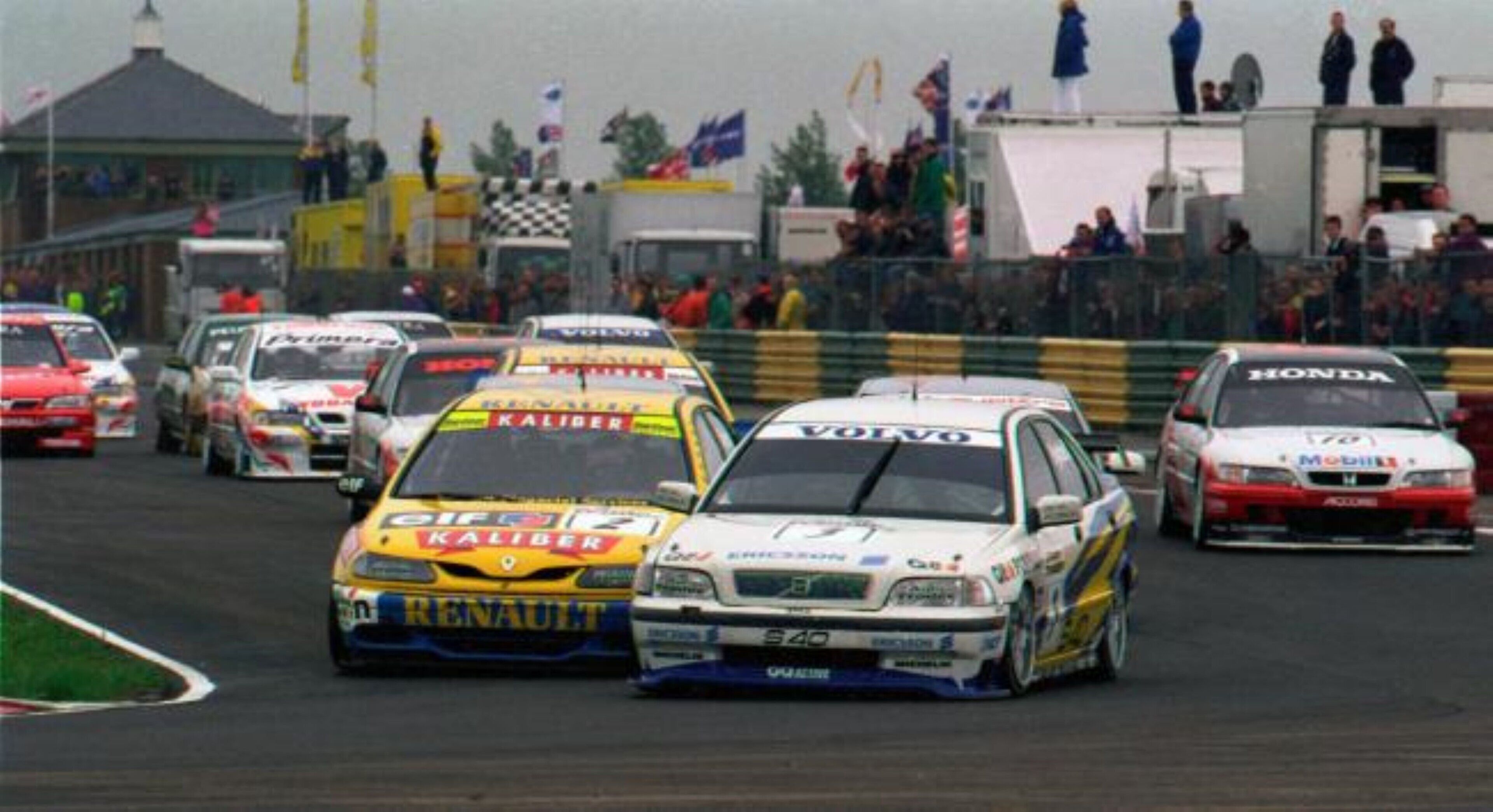 A racing event with multiple cars on a track.