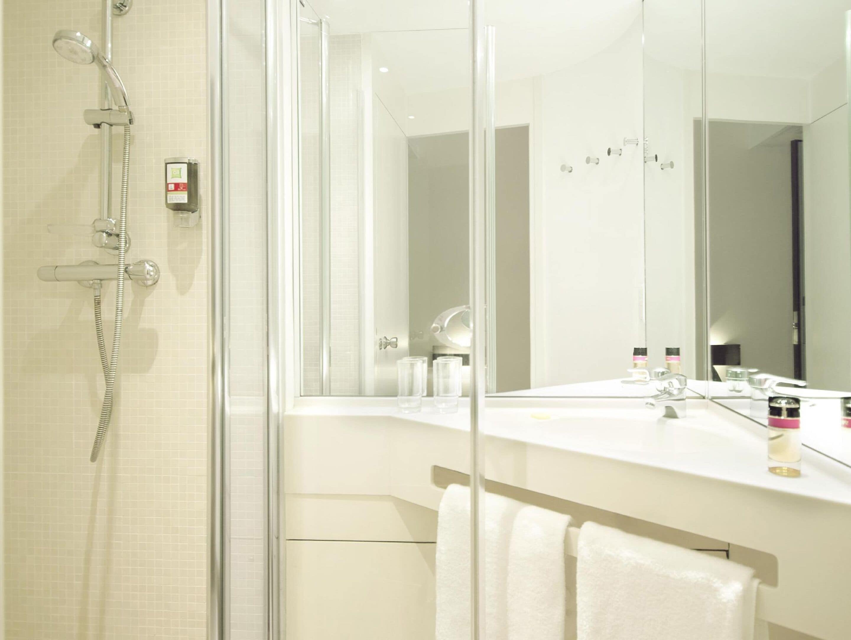 shower, eco-friendly toiletries, hair dryer, towels