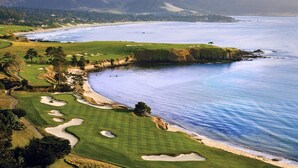 A coastal golf course with a view of the ocean and distant mountains. - Comfort Inn Monterey Peninsula Airport (Monterey)