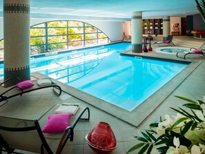 Indoor pool, open 7:00 AM to 10:00 PM, pool loungers