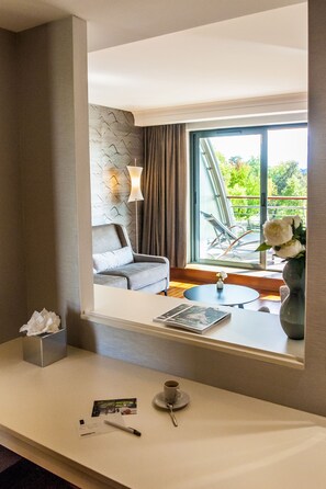 Deluxe Suite, 1 King Bed, Terrace (Grounds view) | Living area | 55-inch flat-screen TV with satellite channels, TV, offices