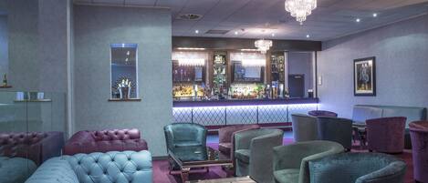A bar area with seating and a bar counter.