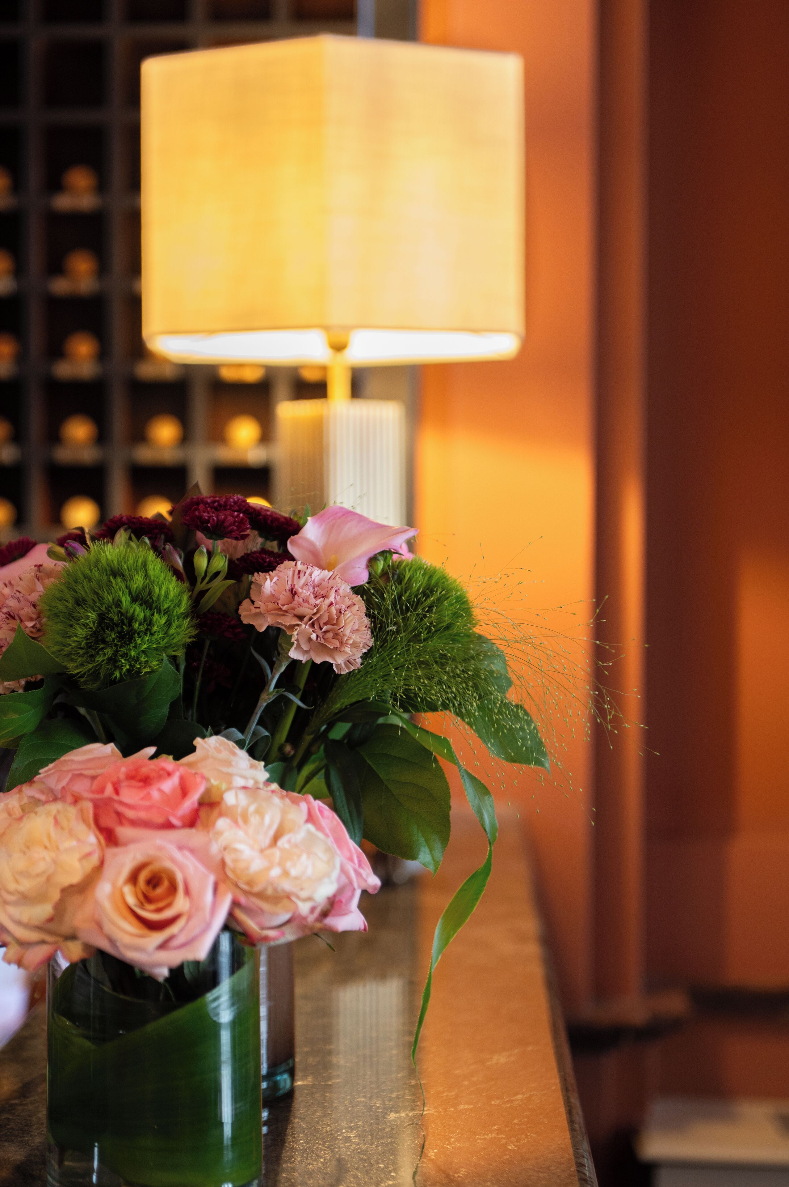 A vase with flowers on a table.