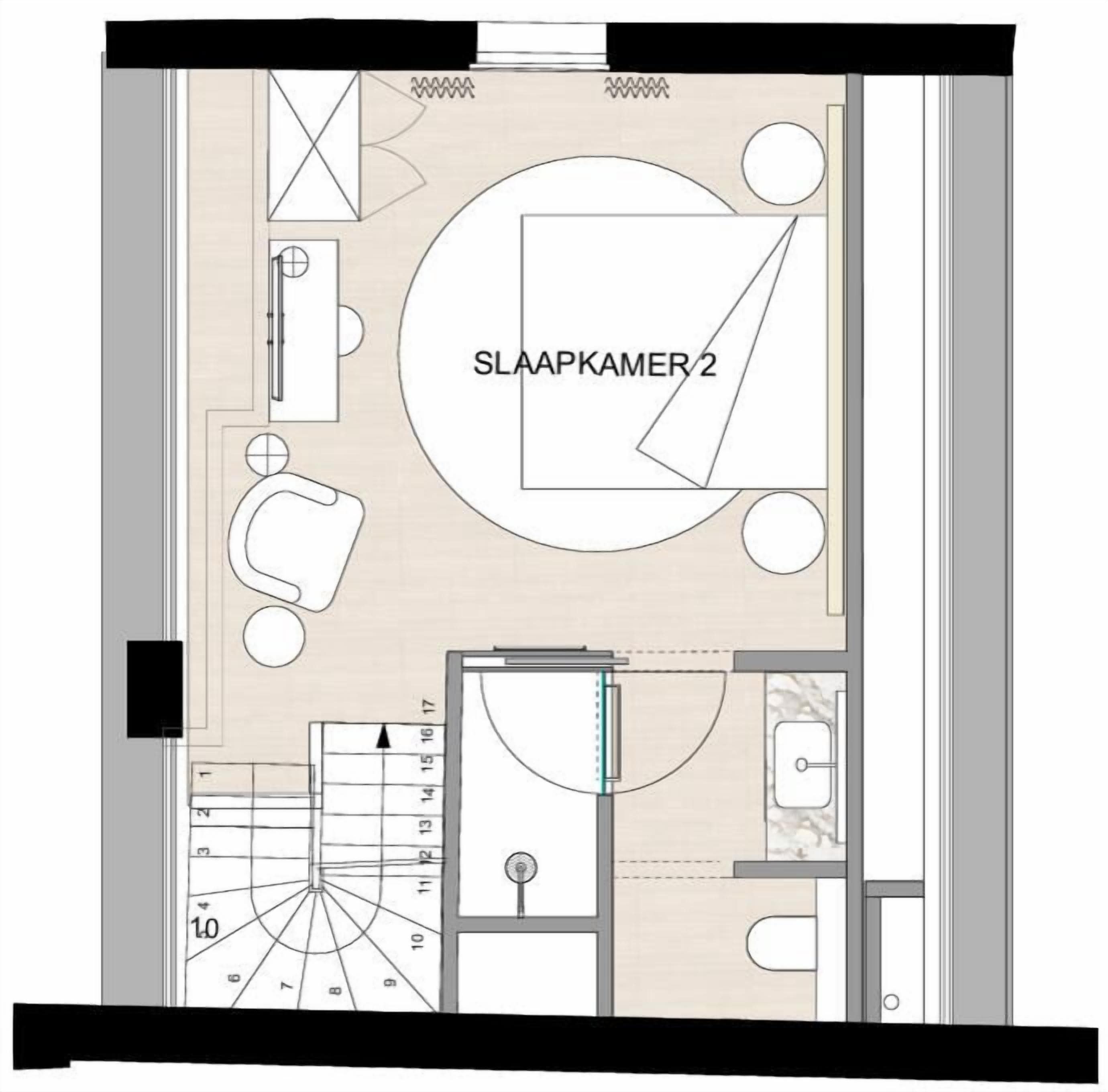 Pianta della camera d'albergo con letto, bagno, piccola area salotto e angolo cottura.