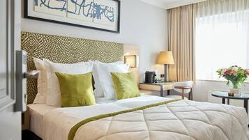 Hypo-allergenic bedding, down duvets, pillow-top beds, minibar