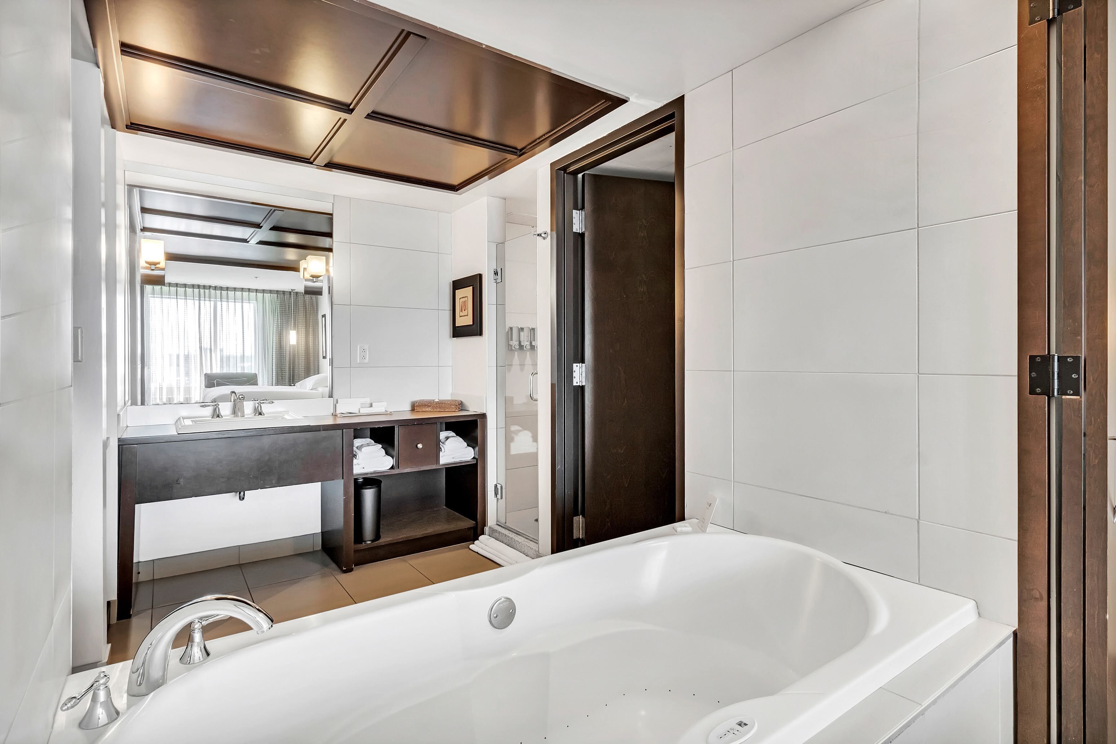 room, 1 king bed, jetted tub | bathroom | hair dryer, bathrobes, towels, soap