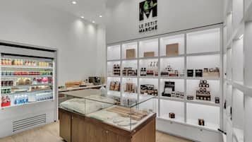 A clean, modern retail space with a refrigerated section on the left and a display of various products on the right.