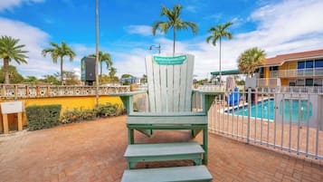 Outdoor pool, open 9:00 AM to 8:00 PM, pool umbrellas, pool loungers