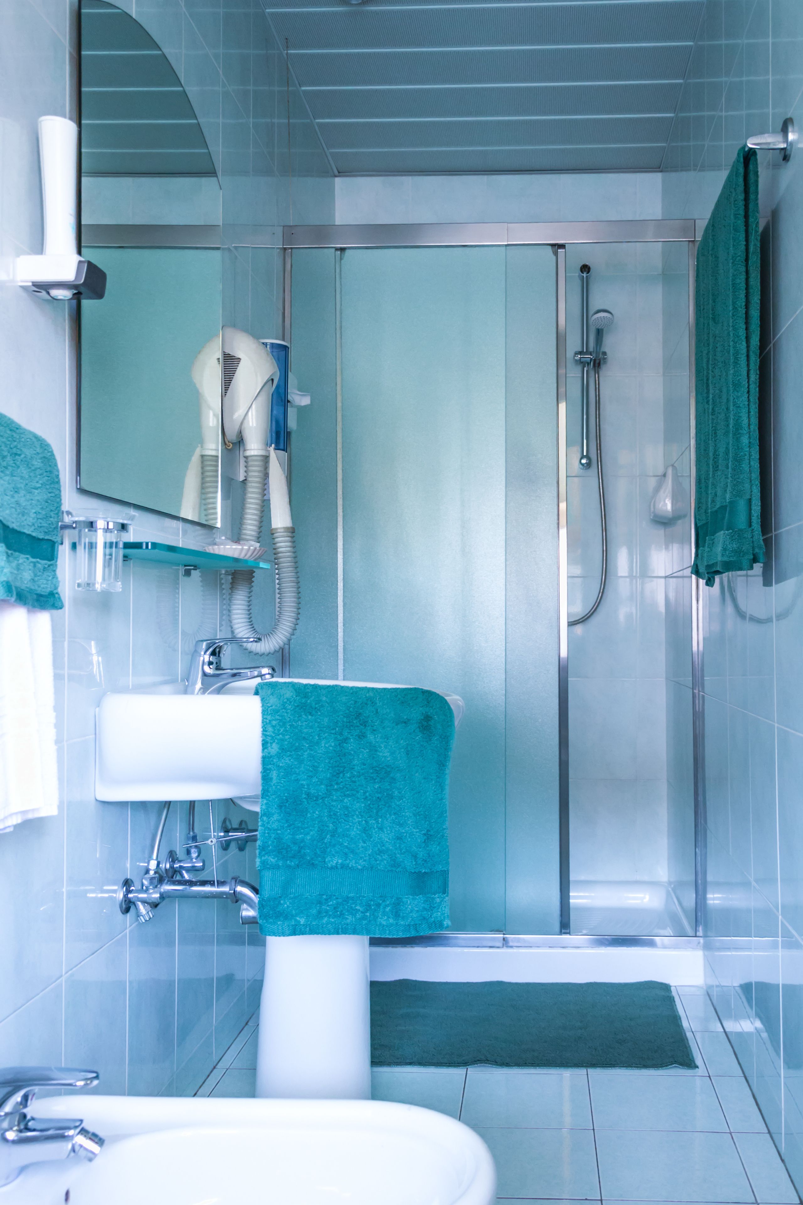 quadruple room | bathroom | shower, free toiletries, hair dryer, dressing gowns