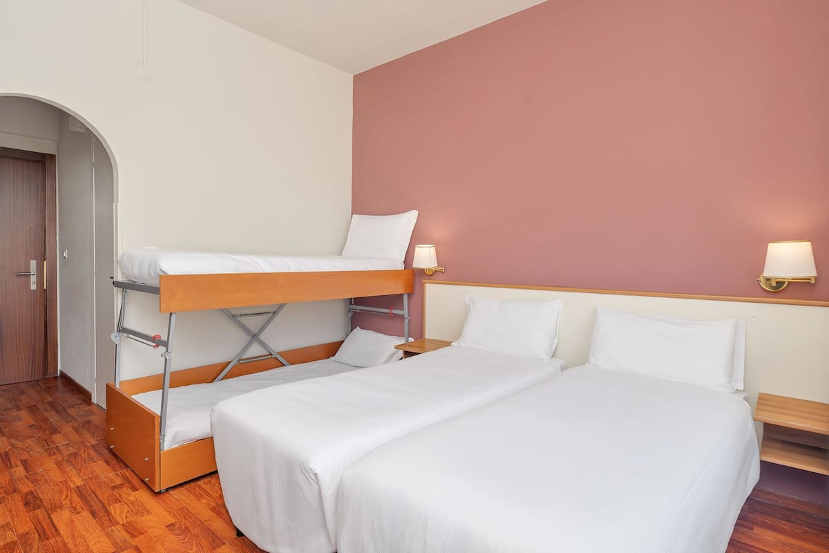 Quadruple Room, Non Smoking, Balcony | In-room safe, desk