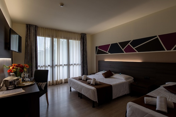 Classic Triple Room | Minibar, in-room safe, desk, laptop workspace