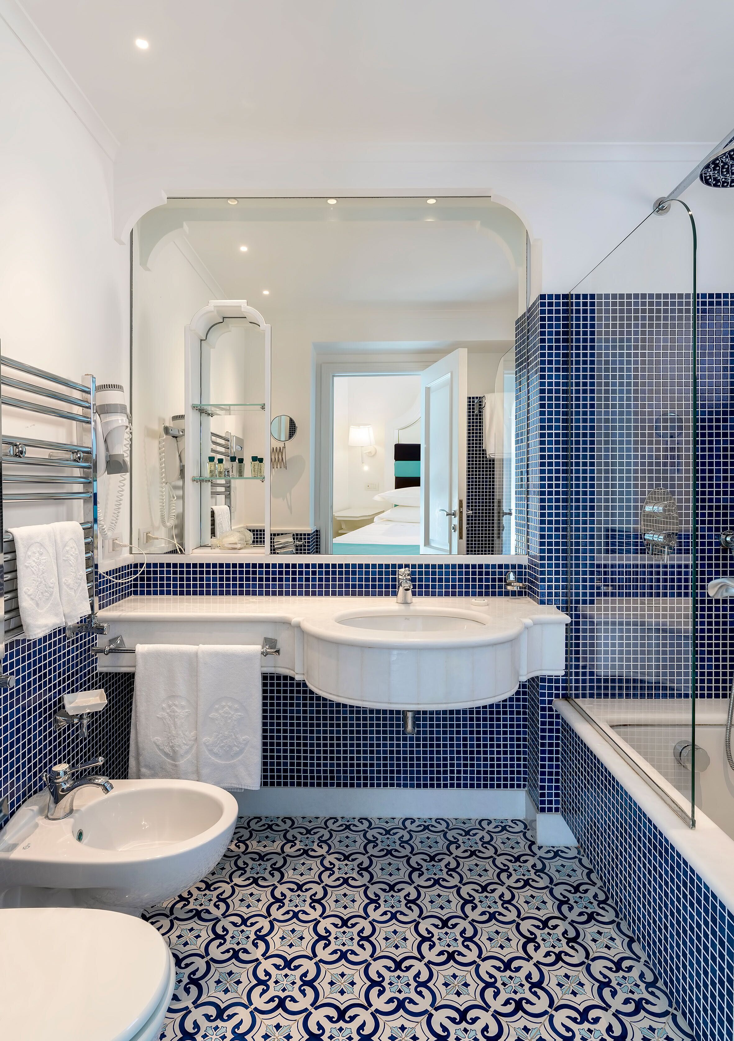 premier room, patio, poolside | bathroom | designer toiletries, hair dryer, slippers, bidet