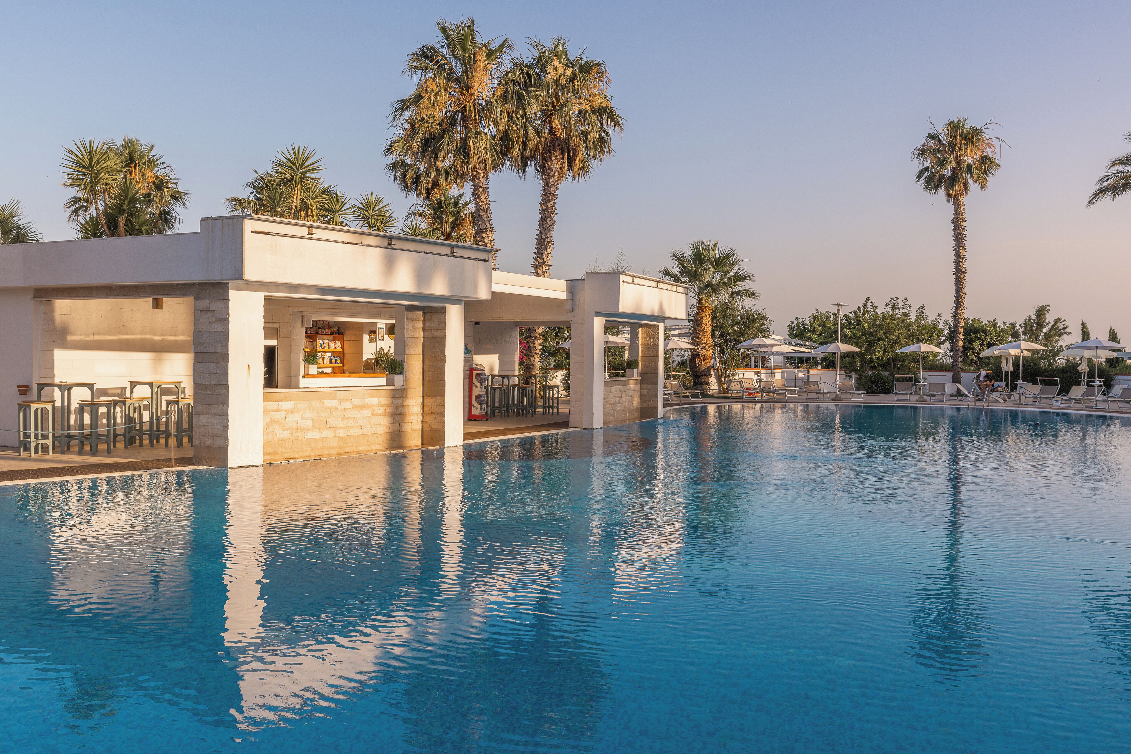 seasonal outdoor pool, pool umbrellas, pool loungers