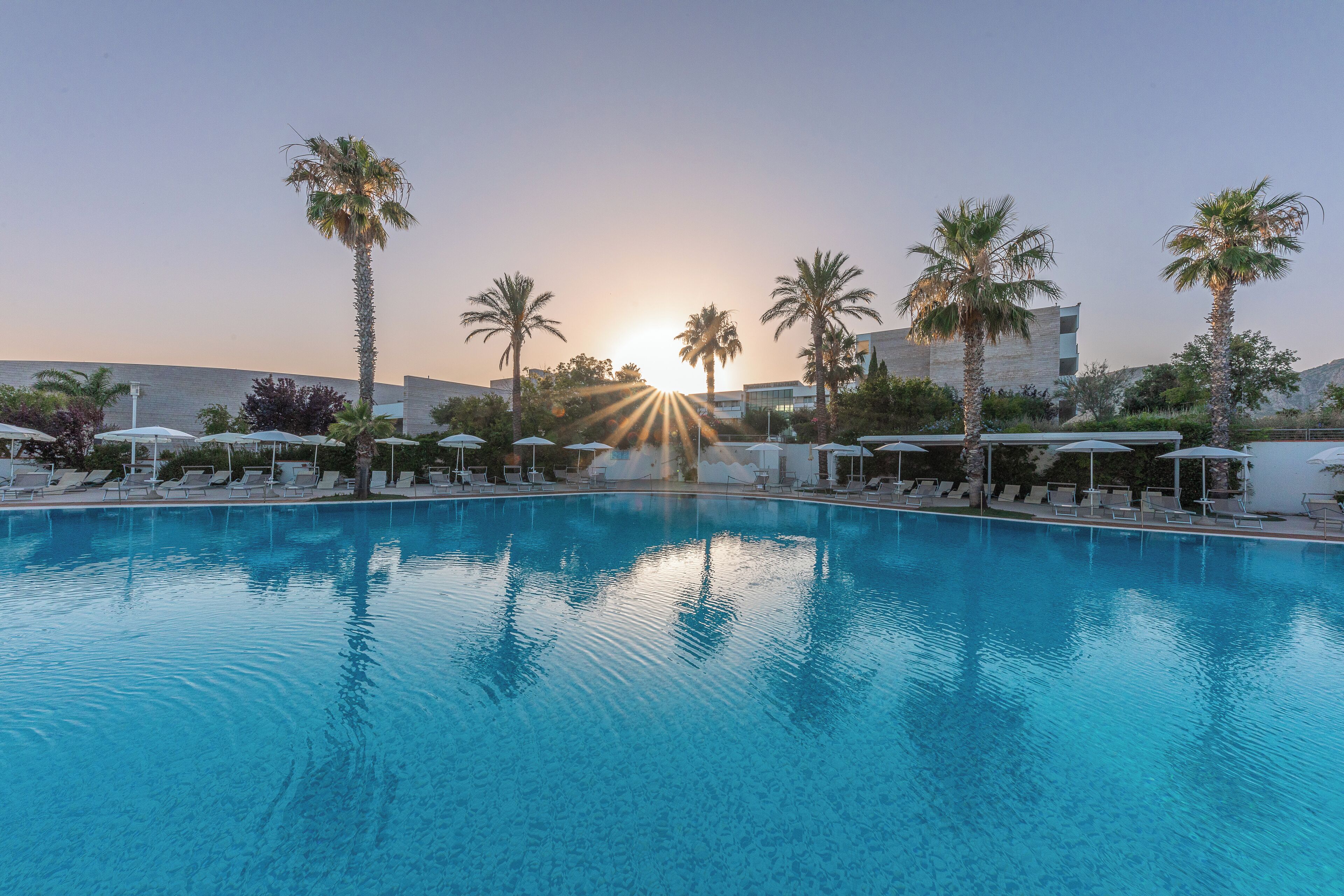 seasonal outdoor pool, pool umbrellas, pool loungers