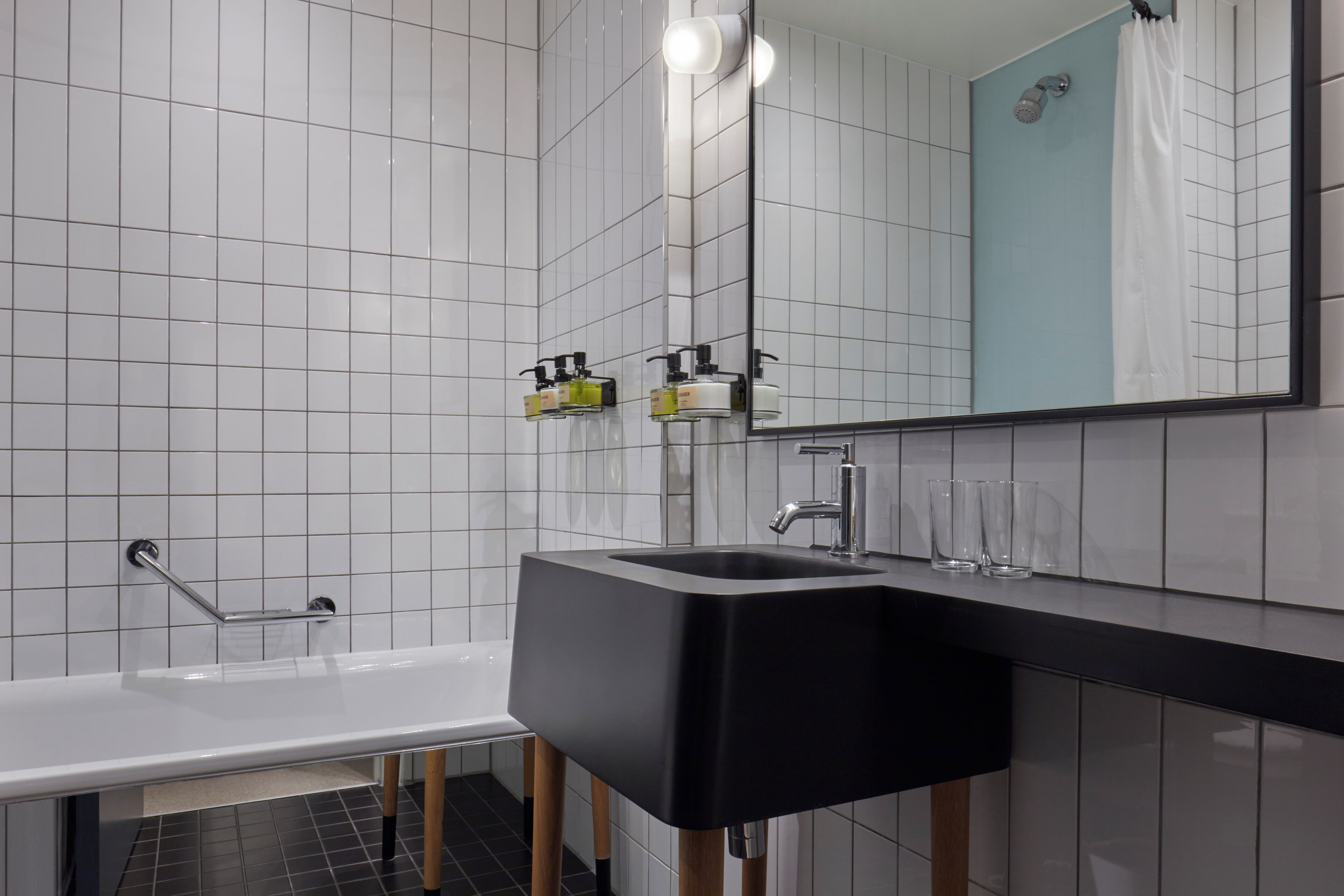 bathtub, eco-friendly toiletries, hair dryer, towels