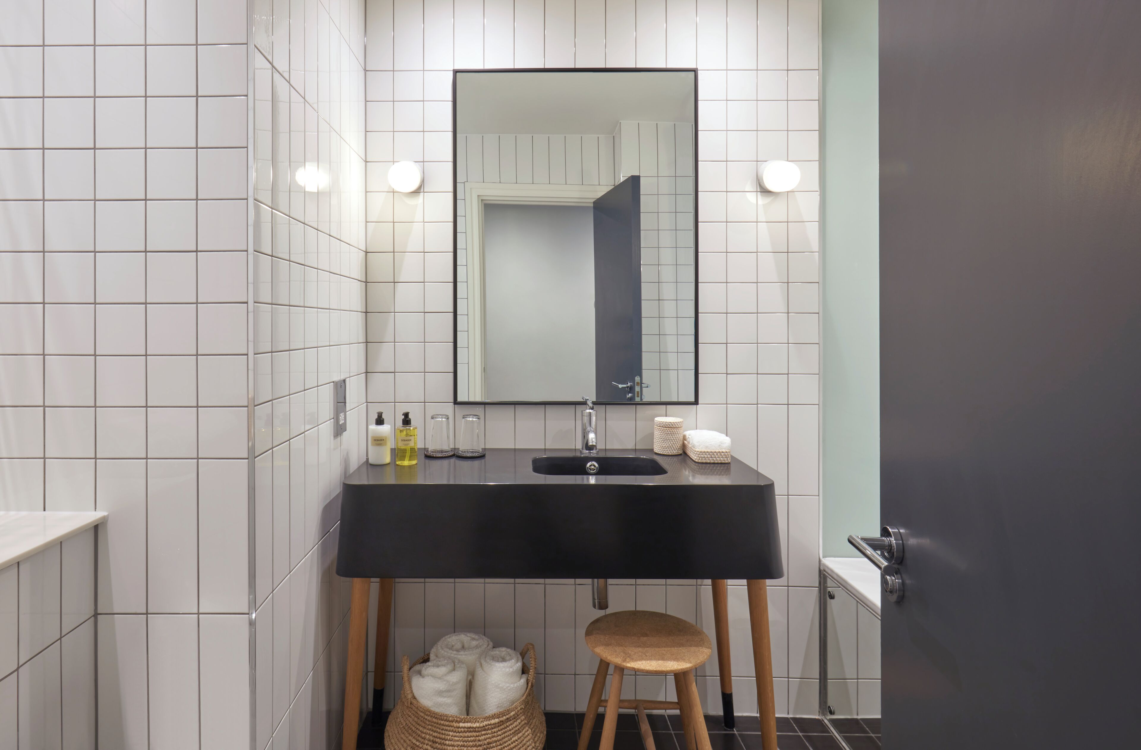 bathtub, eco-friendly toiletries, hair dryer, towels