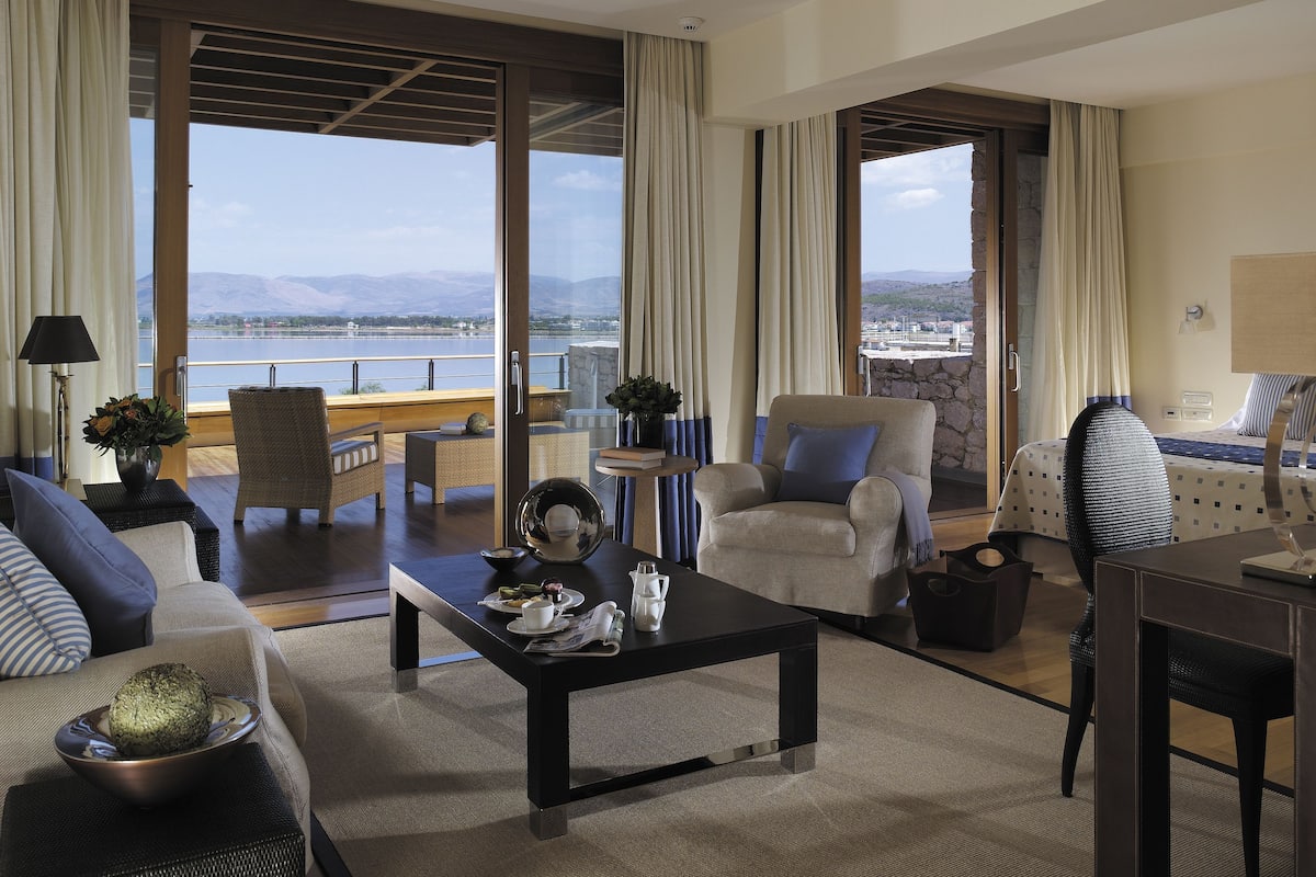 Luxury Suite, Sea View | Minibar, in-room safe, soundproofing, iron/ironing board