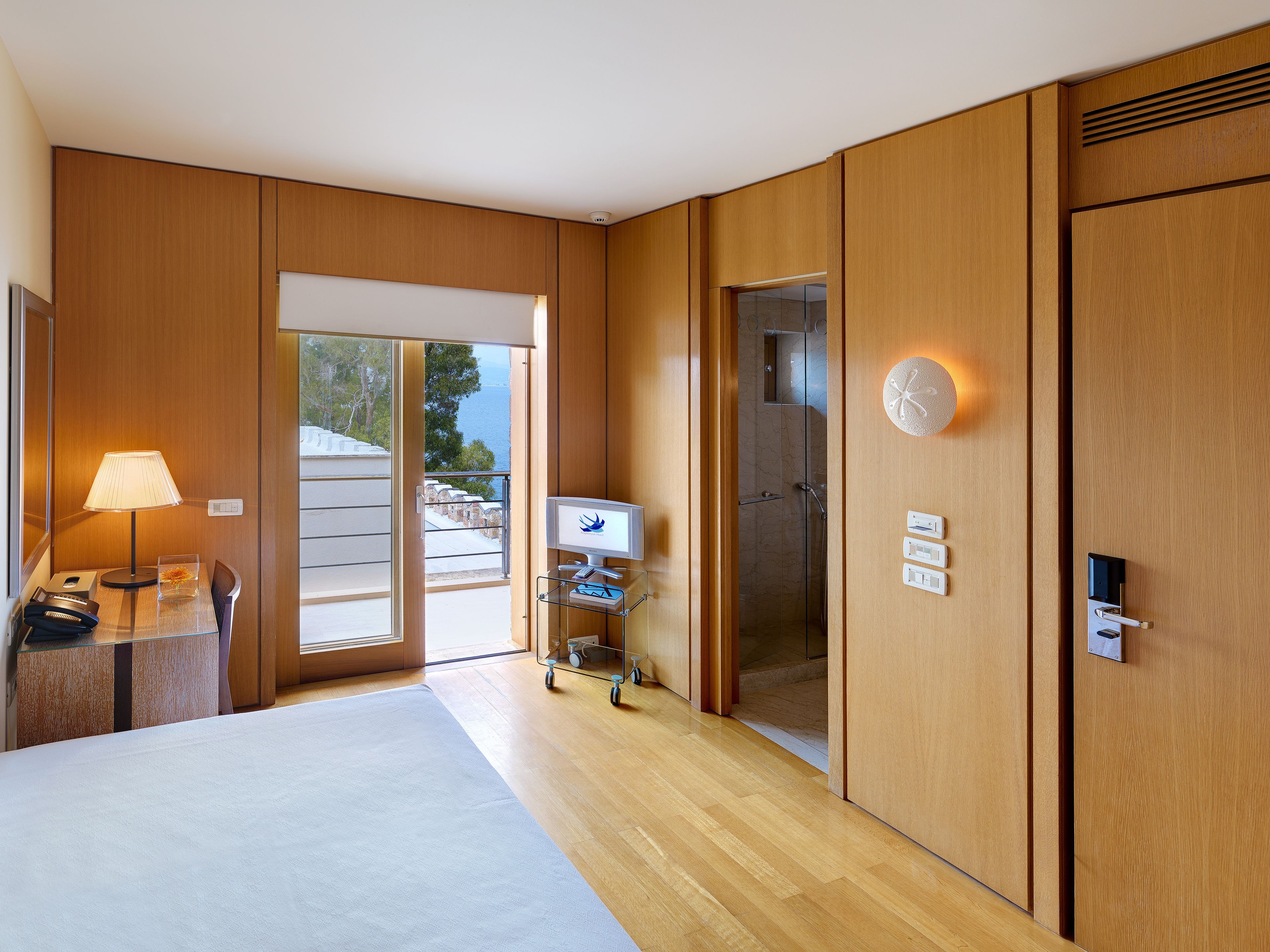 family room, sea view | minibar, in-room safe, soundproofing, iron/ironing board