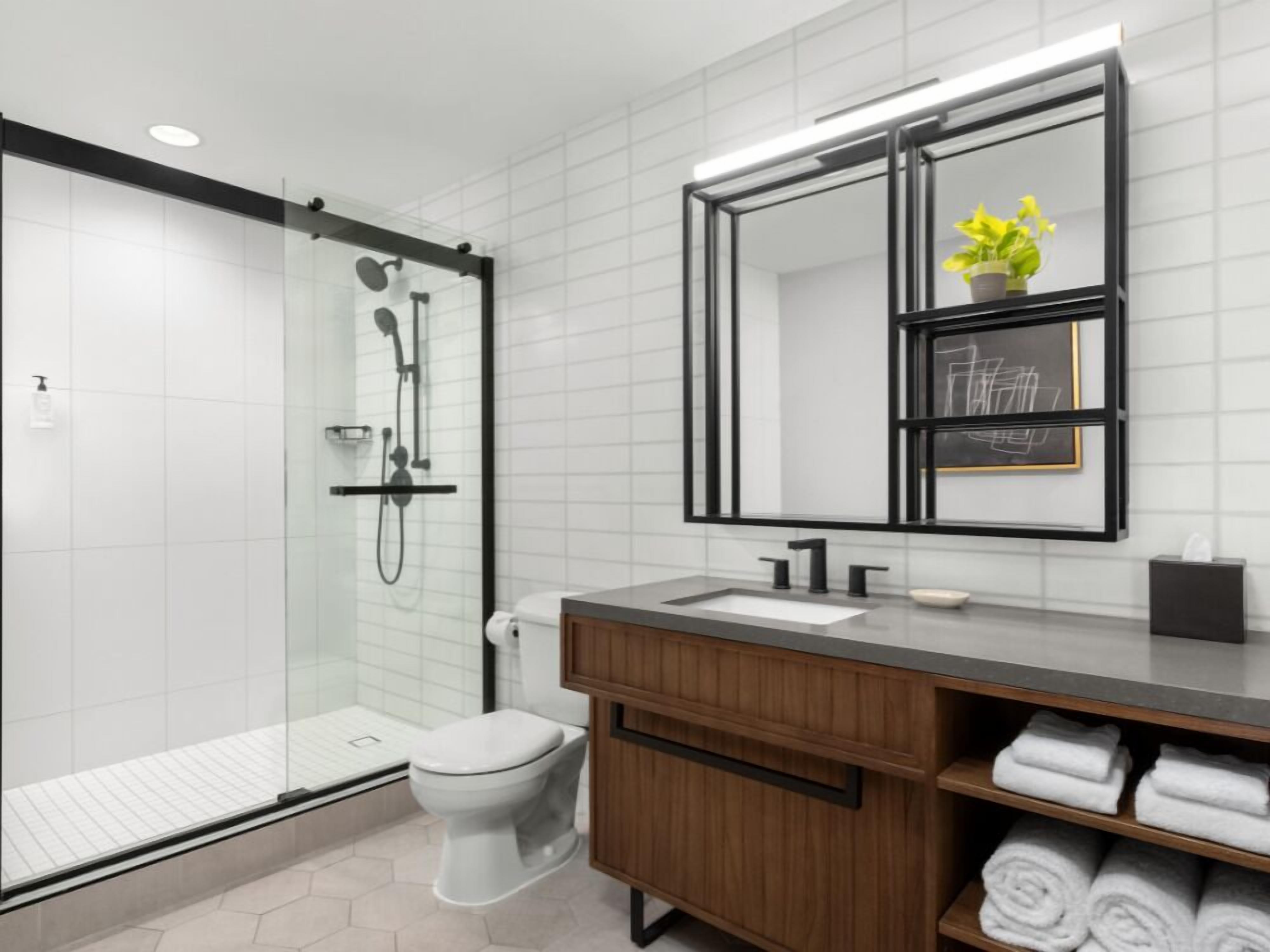 designer toiletries, hair dryer, towels, soap