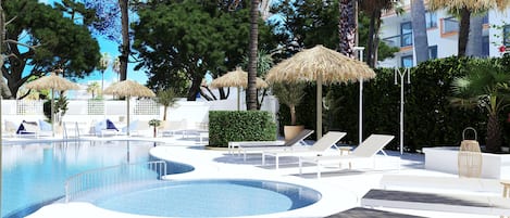 Seasonal outdoor pool, open 9:00 AM to 8:00 PM, pool umbrellas