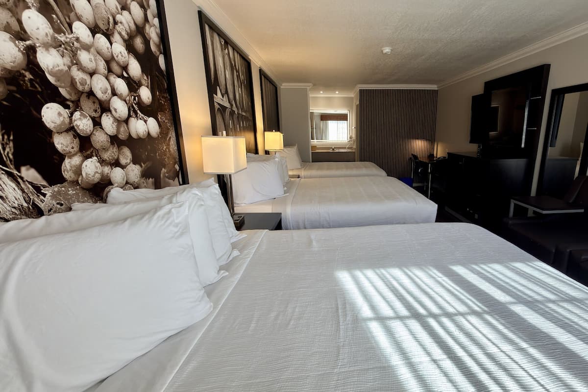 Standard Room, Multiple Beds | Pillowtop beds, in-room safe, desk, laptop workspace