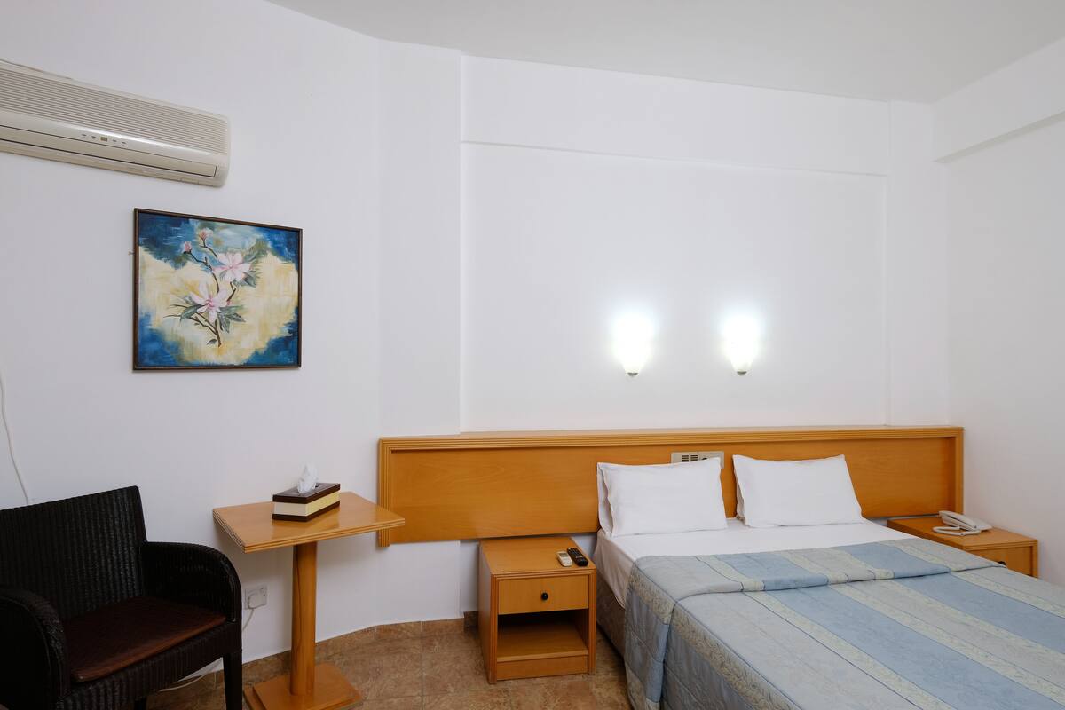 Desk, laptop workspace, blackout curtains, free WiFi