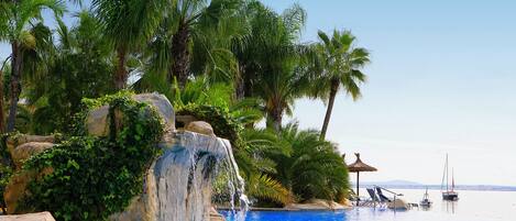 Indoor pool, seasonal outdoor pool, pool umbrellas, pool loungers