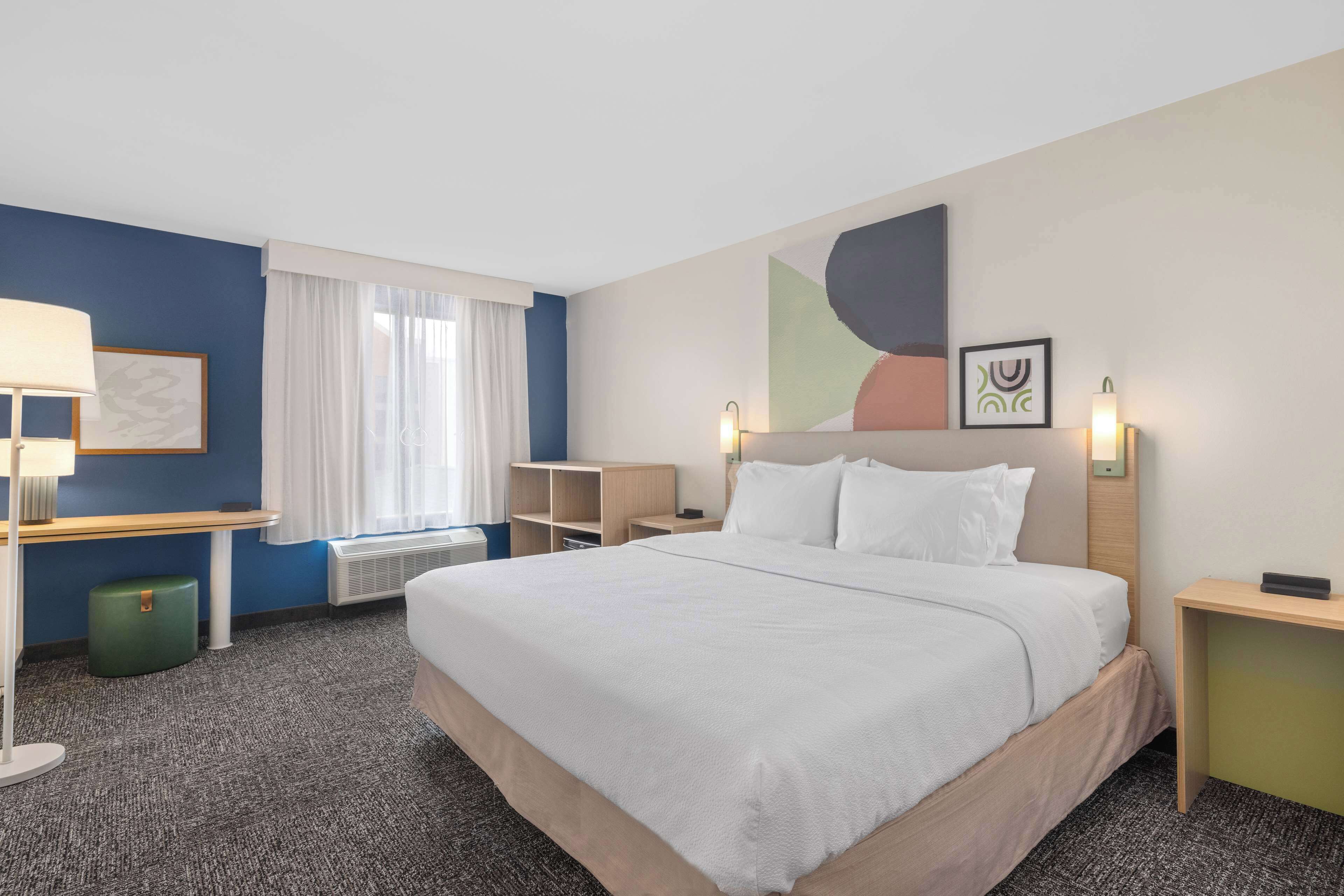 premium bedding, desk, blackout curtains, iron/ironing board