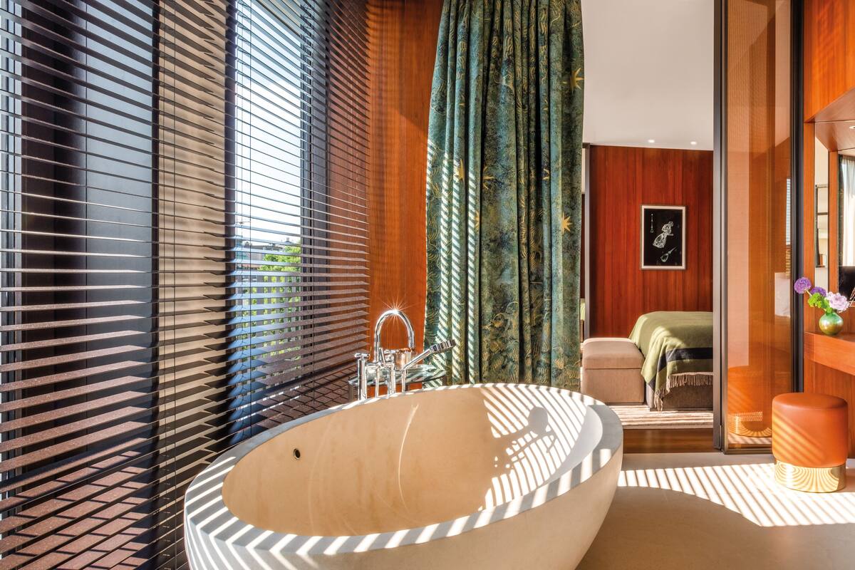 suite, 1 bedroom, non smoking, fireplace | bathroom | separate bathtub and shower, rainfall showerhead, hair dryer, bathrobes