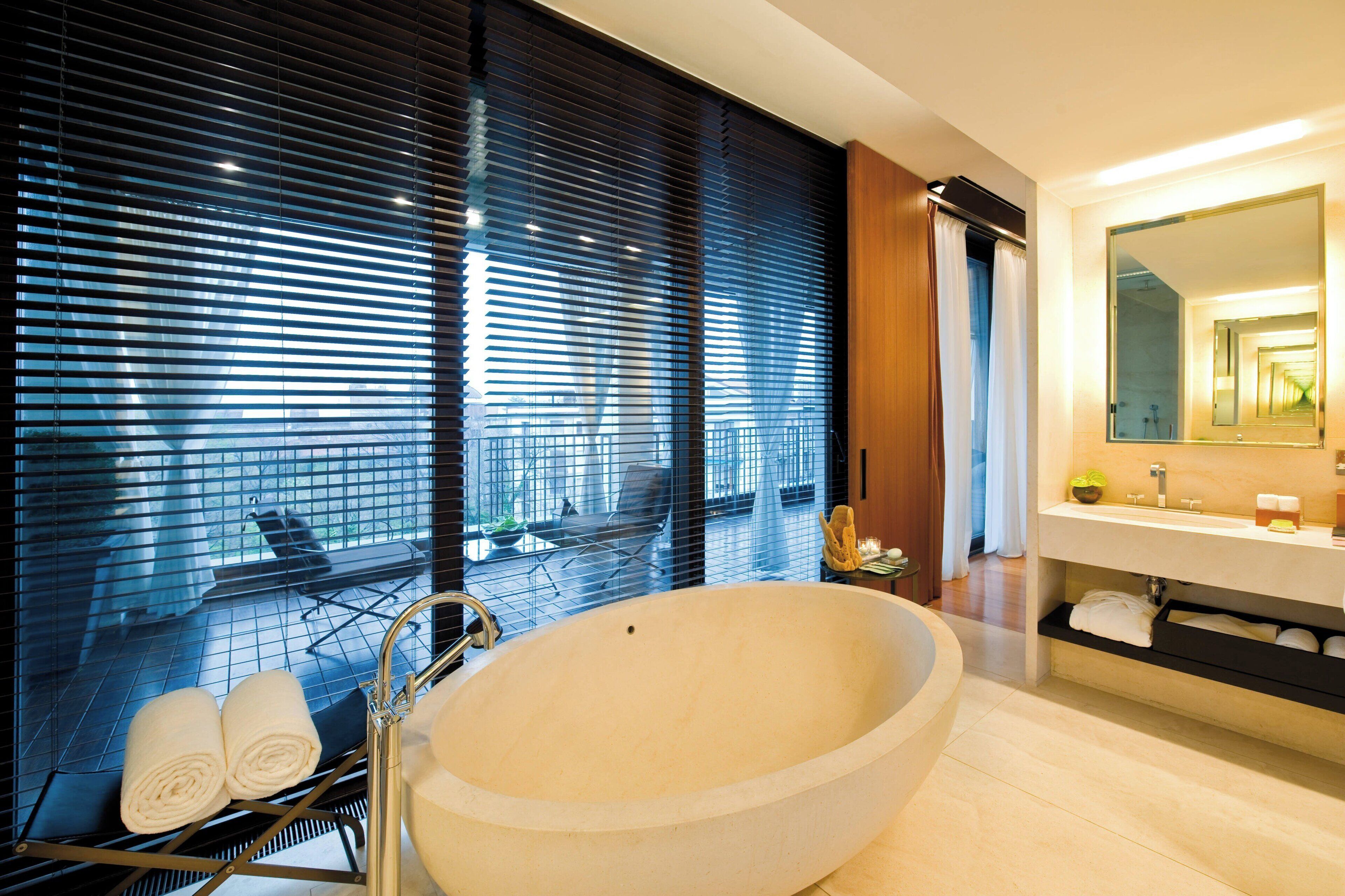 suite, 1 bedroom, non smoking, fireplace | bathroom | separate bathtub and shower, rainfall showerhead, hair dryer, bathrobes
