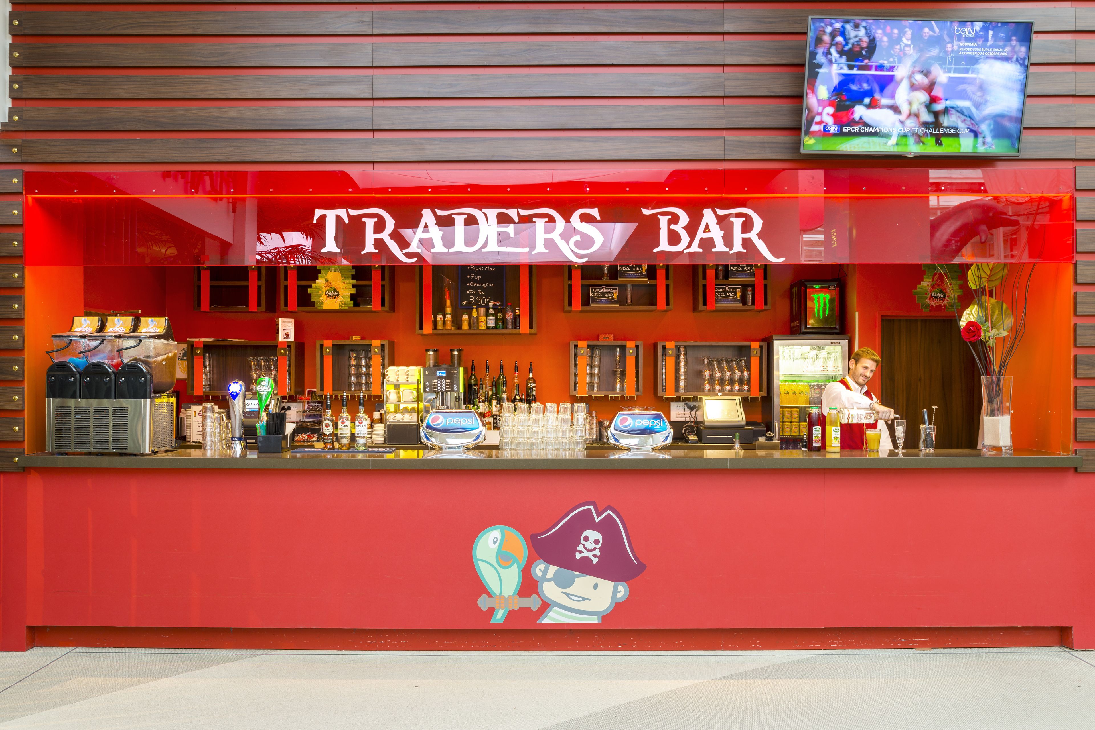 A red bar with a pirate-themed design, including a cartoon pirate and parrot.