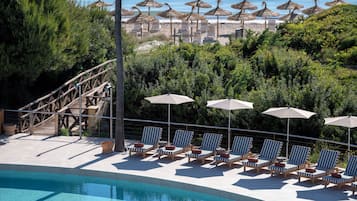 Indoor pool, outdoor pool, pool umbrellas, pool loungers