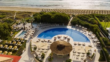 Indoor pool, outdoor pool, pool umbrellas, pool loungers