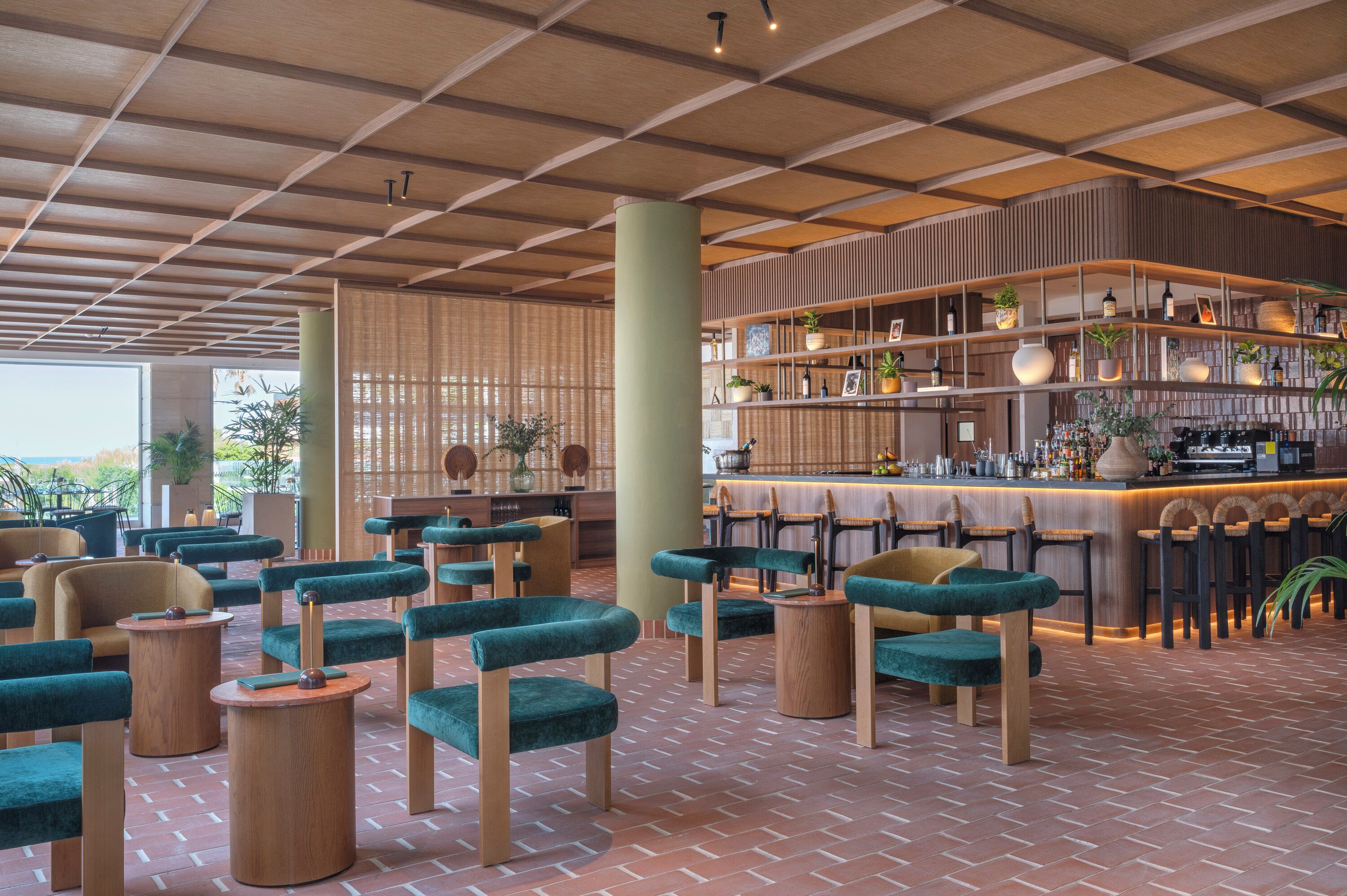 A modern bar area with seating and a bar counter.
