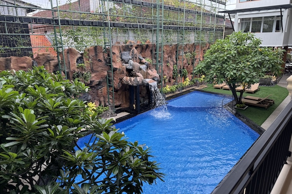 Outdoor pool, open 8:00 AM to 10:00 PM, pool umbrellas, sun loungers