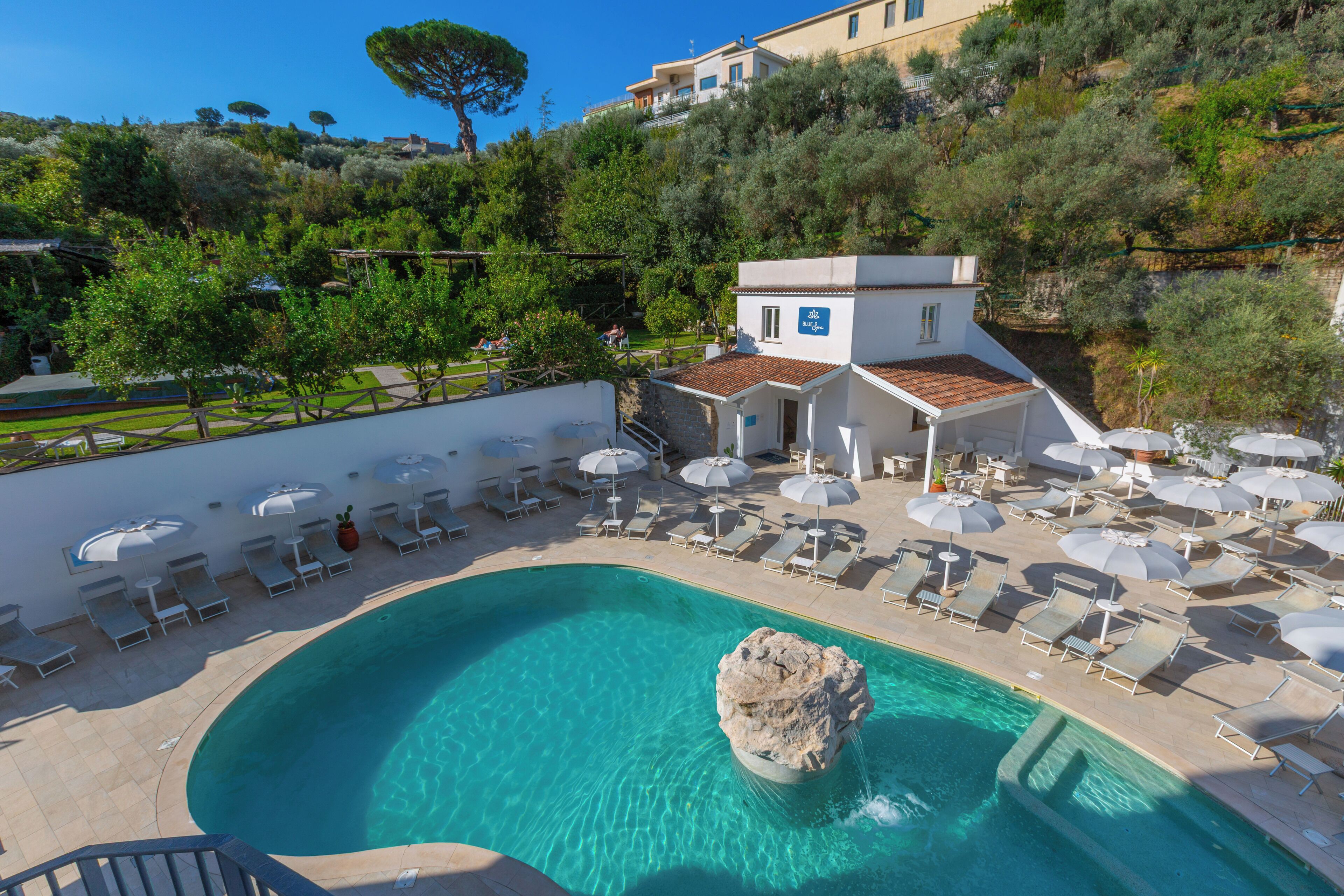 Seasonal outdoor pool, open 10 AM to 6 PM, pool umbrellas, pool loungers