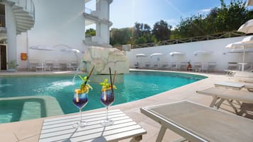 Seasonal outdoor pool, open 10 AM to 6 PM, pool umbrellas, pool loungers