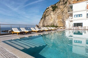 Outdoor pool, open 10:00 AM to 6:00 PM, pool umbrellas, sun loungers