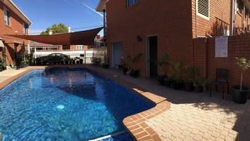 Outdoor pool, open 8:30 AM to 8:00 PM, pool umbrellas, pool loungers