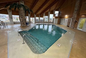 An indoor swimming pool with clear water, a no diving sign, and a lifeguard stand. - Days Inn by Wyndham Batavia Ohio (Batavia)