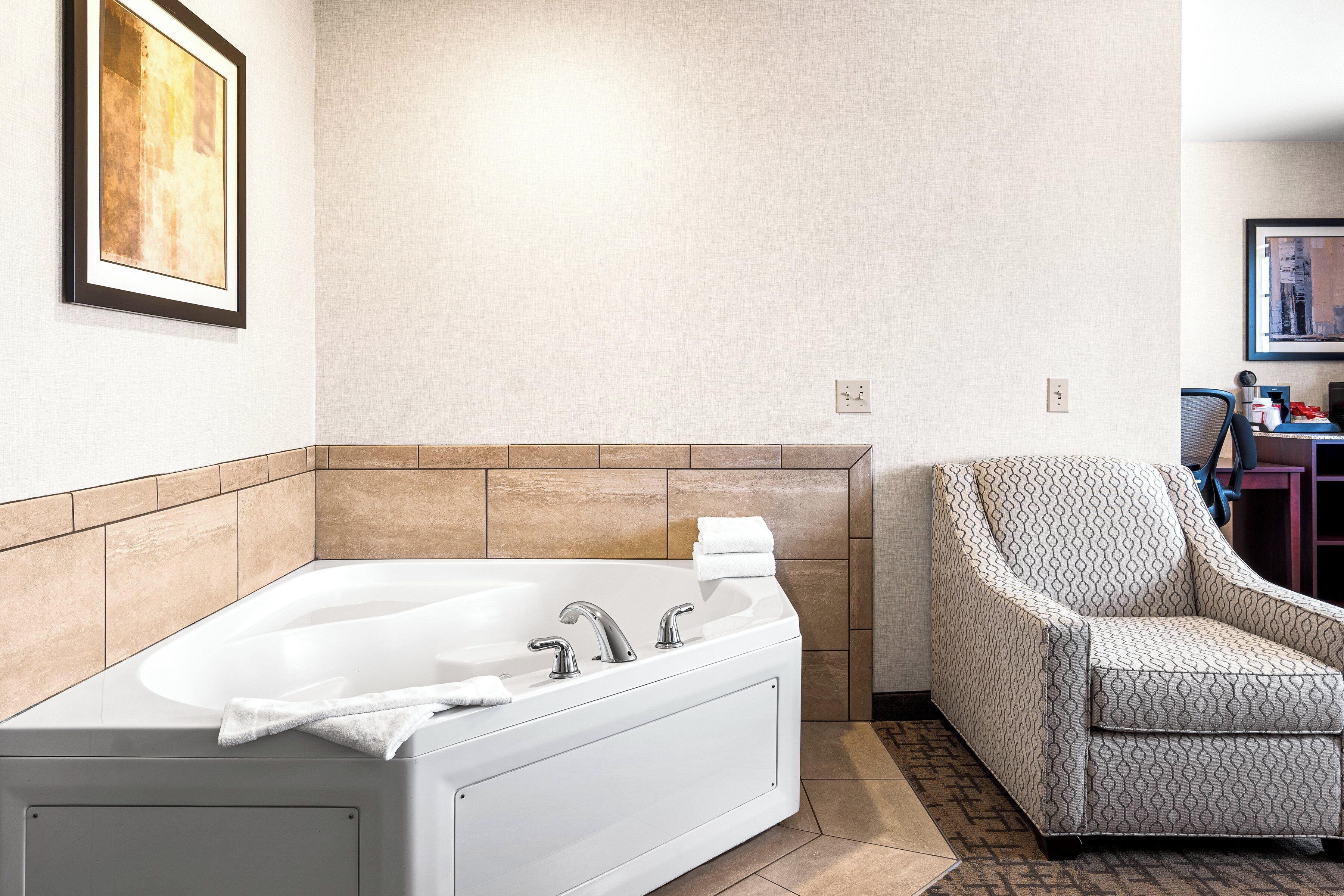 suite, 1 king bed, whirlpool tub, non smoking | premium bedding, desk, laptop workspace, iron/ironing board