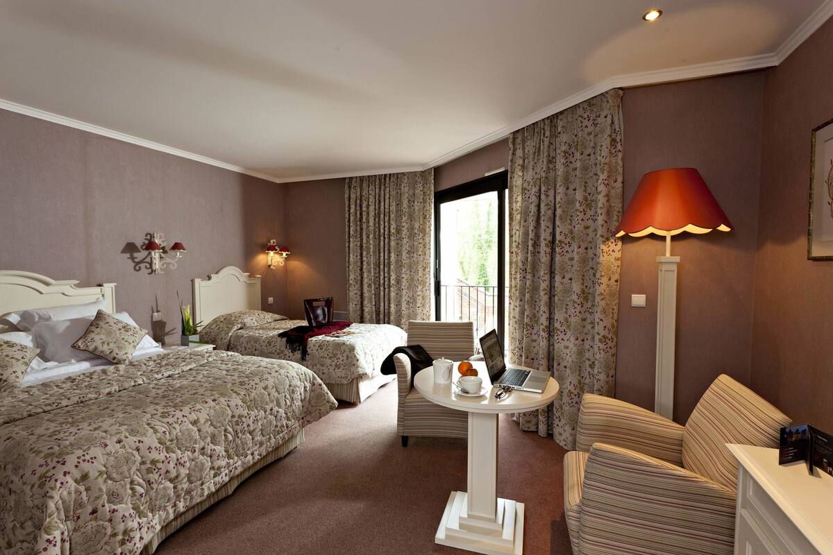 deluxe triple room (pavillon du parc) | in-room safe, blackout curtains, iron/ironing board, free wifi