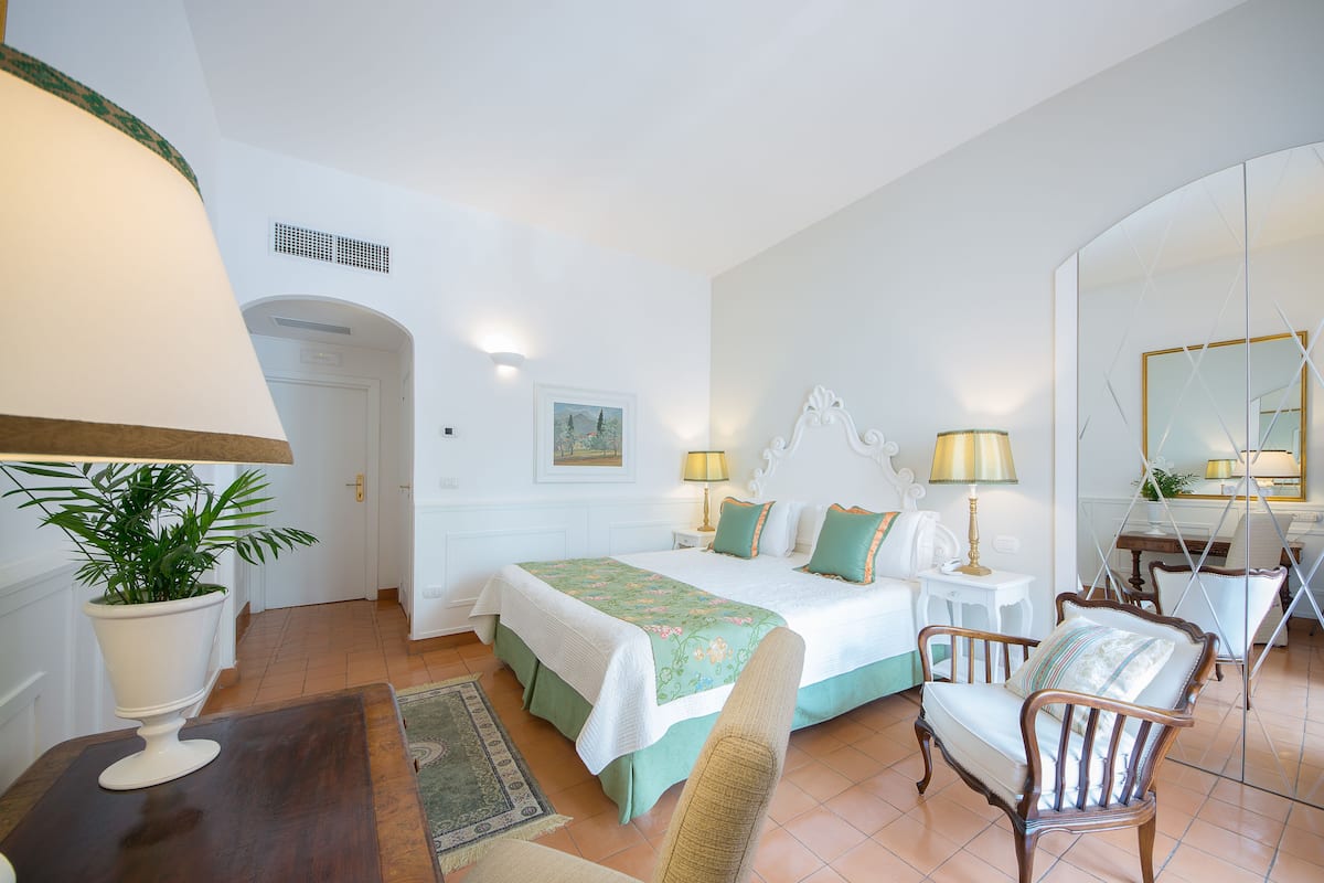 Superior Double Room | Minibar, in-room safe, desk, blackout curtains