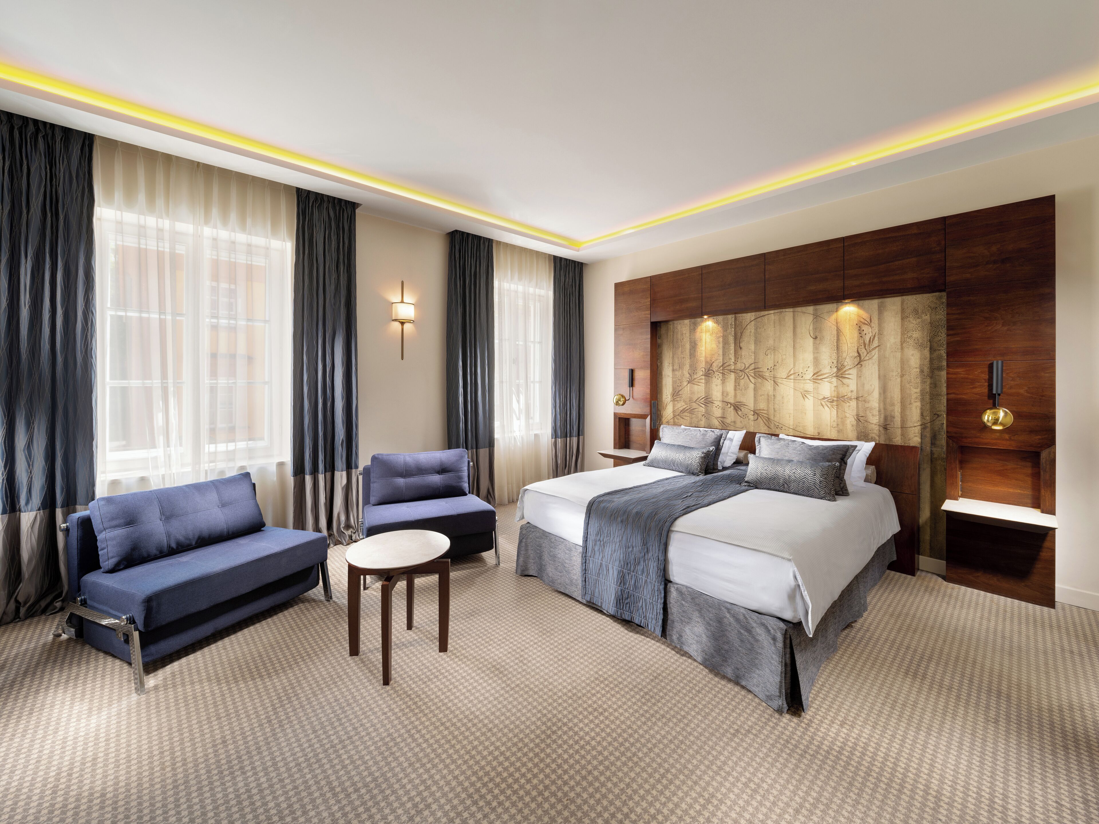 Habitación familiar, varias camas | Ropa de cama hipoalergénica, minibar, caja fuerte y escritorio