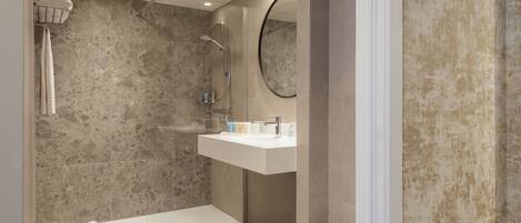 A modern bathroom with a shower, toilet, and sink.