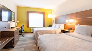 A hotel room with a wooden desk, two beds, a chair, and a large window. - Holiday Inn Express Hereford by IHG (Hereford)