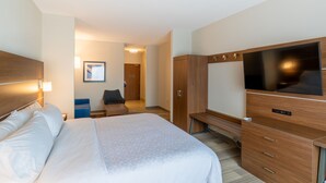 A hotel room with a large bed, a TV, a desk, and a wardrobe. - Holiday Inn Express Hereford by IHG (Hereford)