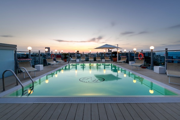 Seasonal outdoor pool, pool loungers