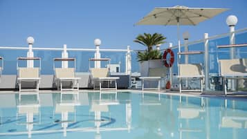 Seasonal outdoor pool, pool loungers