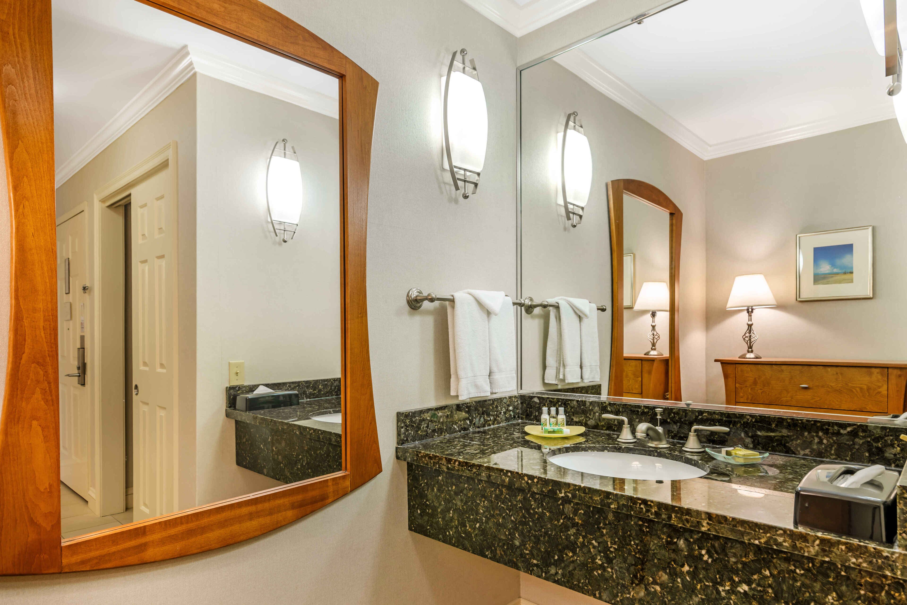 designer toiletries, hair dryer, towels